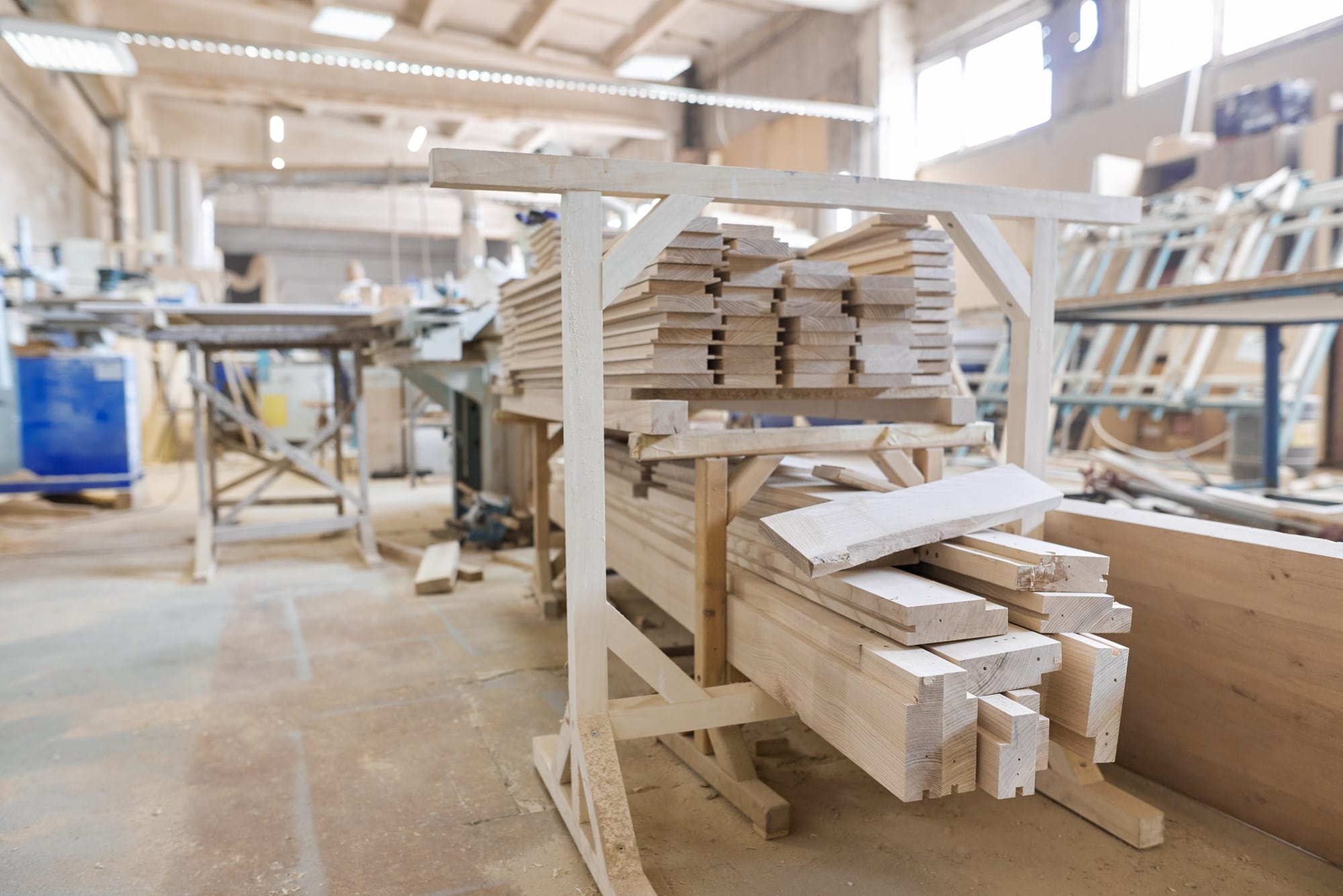 Background carpentry woodworking woodshop, machines and tools, wooden boards, furniture details